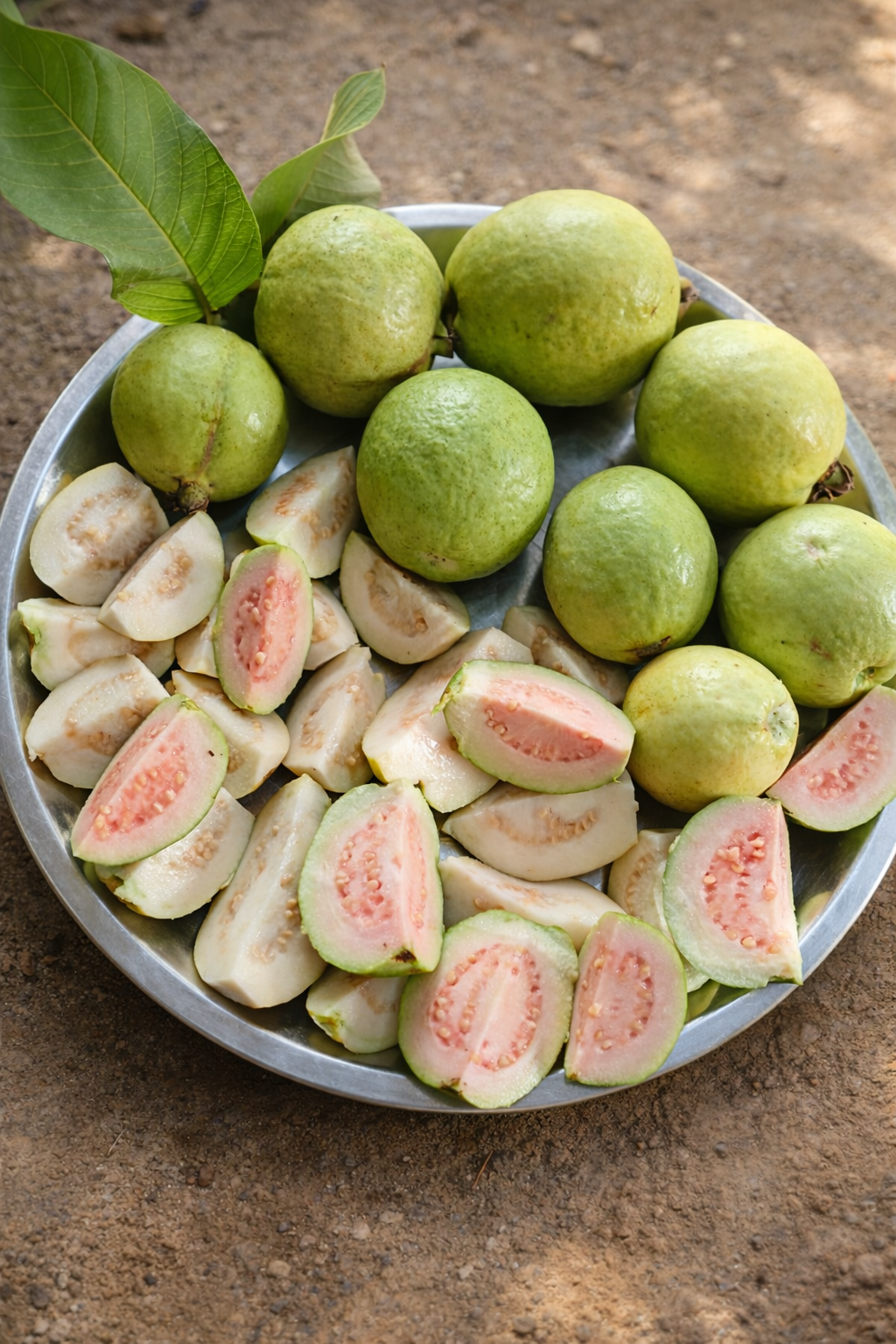 Plate full of fresh sliced guavas