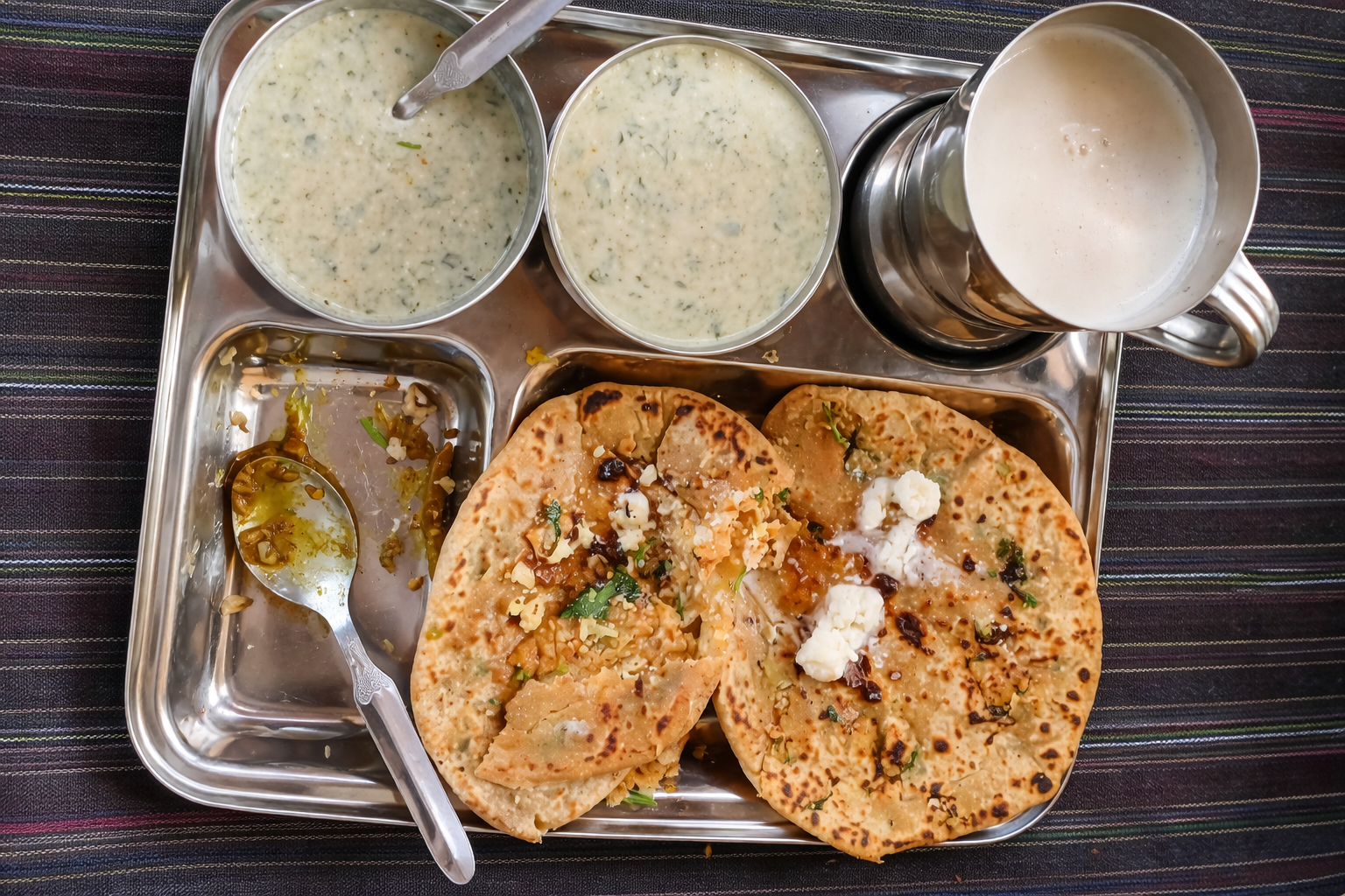 Simple village meal served on a steel tray